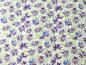 Preview: Patchworkstoff Clothworks aus der Serie Flowershop lila Blüten auf hellgrün